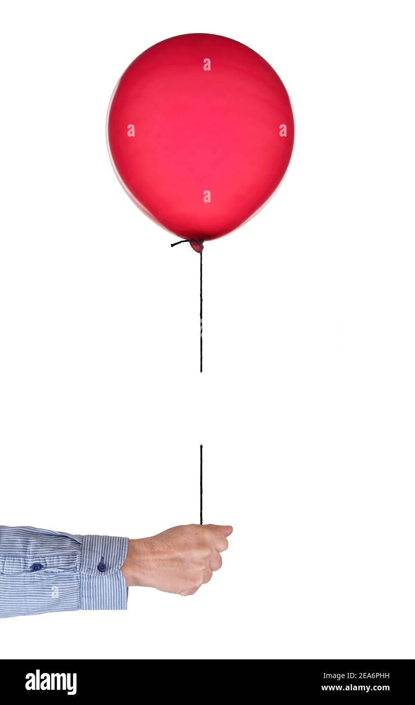 Red party balloon on string hi-res stock photography and images - Alamy