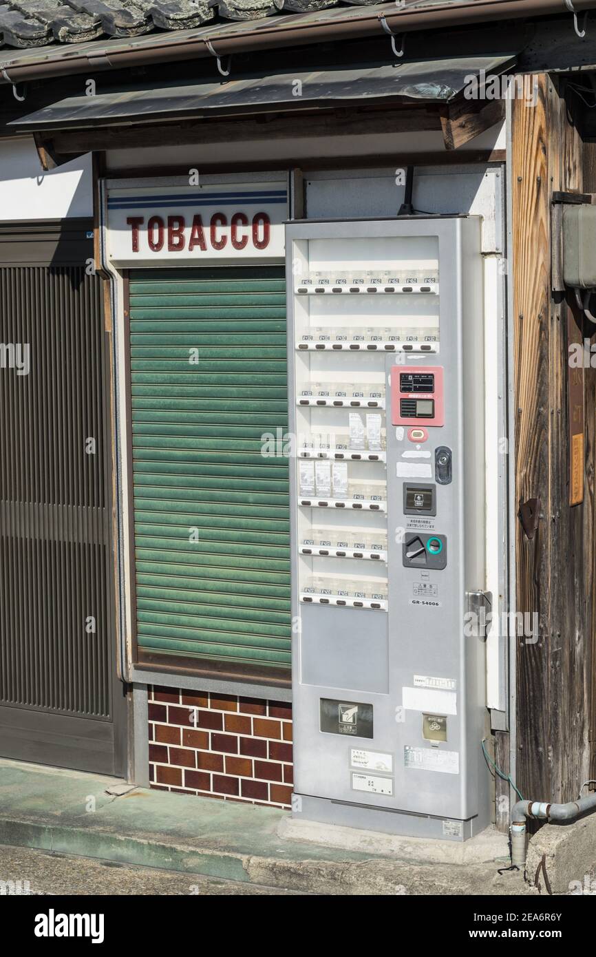 A tiny shuttered, closed tobacco kiosk in a quiet back street in Nara,  Japan Stock Photo