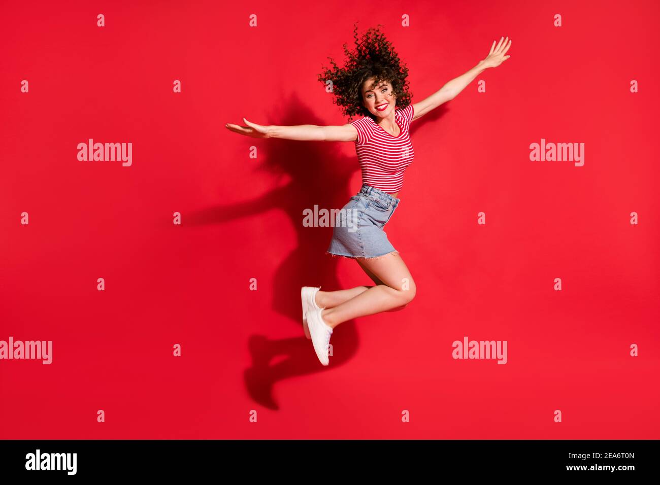 Full body photo of excited happy young girl jump fly wings hands x-mas ...