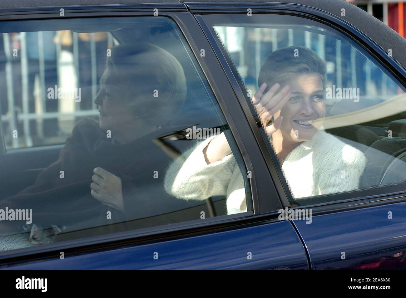 ENSCHEDE, THE NETHERLANDS - APR 28, 2006: : Royal highness Queen Beatrix of The Netherlands (left) and princess Maxima waving when they are leaving th Stock Photo