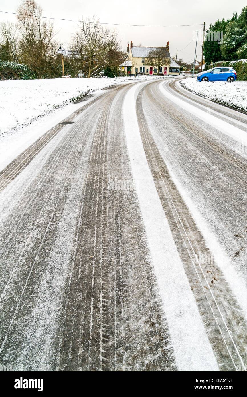 Low Angle View Along A Country Road Covered In Snow And Ice Near Broomfield Herne Bay After Overnight Snowfall During The Beast Of The East 2 Storm In 21 Stock Photo Alamy