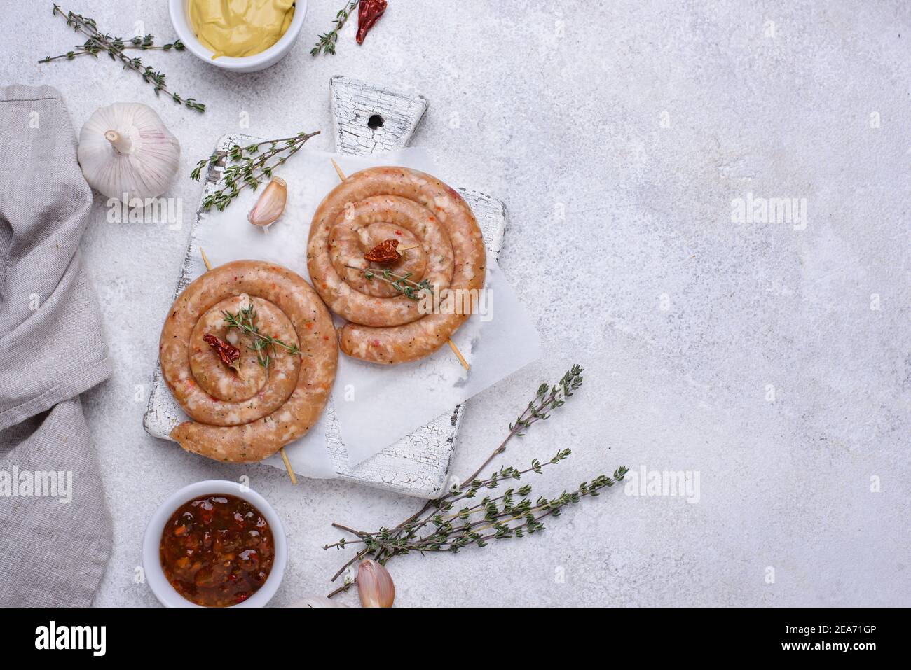 Raw uncooked chicken sausages with spices Stock Photo Alamy