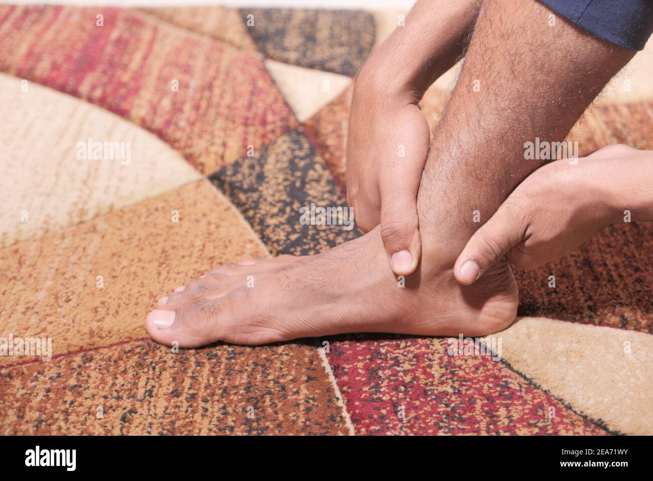Close up young man suffering feet pain  Stock Photo