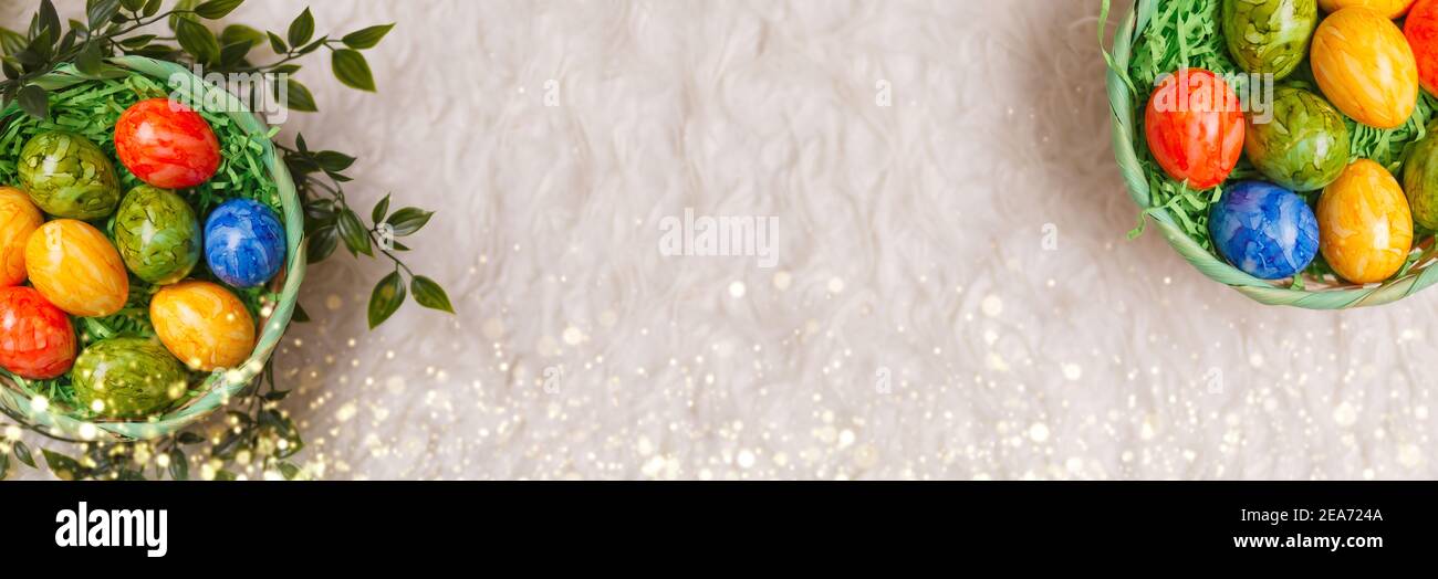 Banner for easter card. Flat lay composition with Easter eggs on white background. Stock Photo