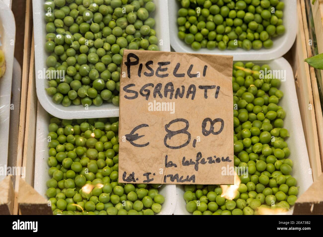 Fresh peas for sale on a market stall in Bologna Italy Stock Photo