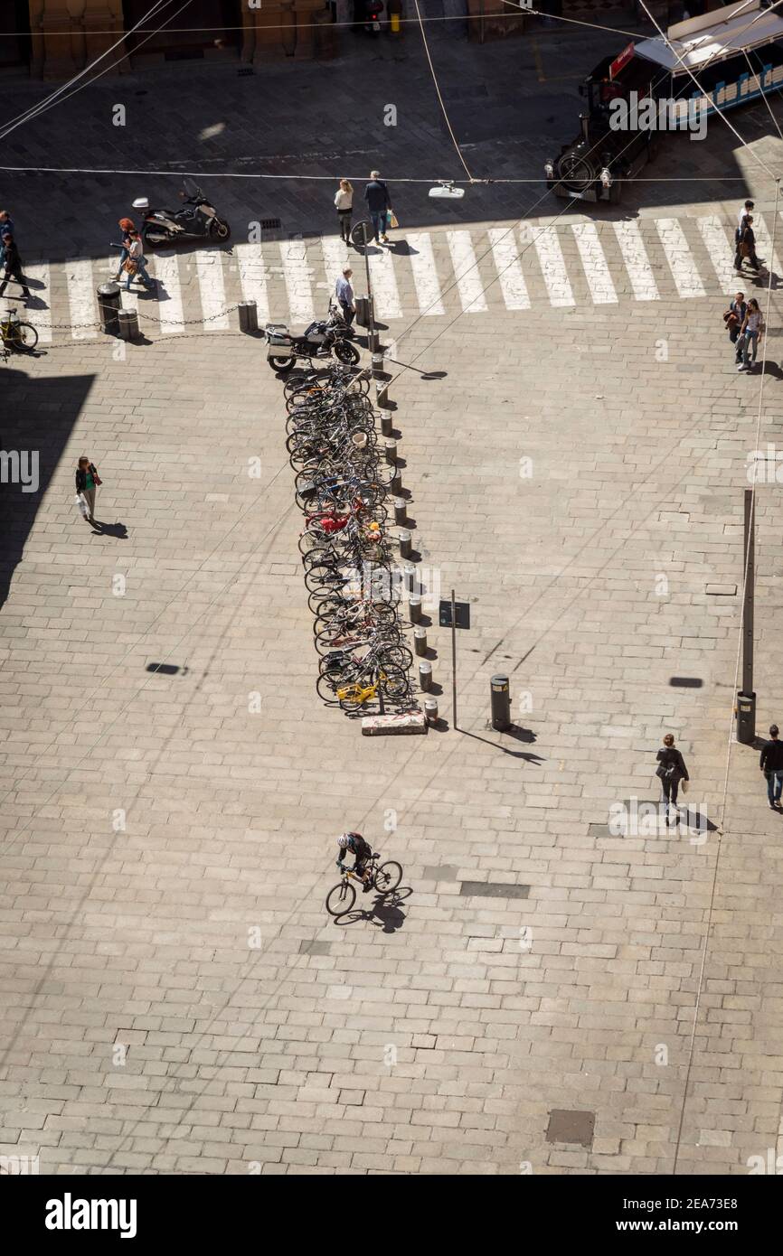 An aerial view of a square in the city of Bologna Italy showing people and a cycle rack Stock Photo