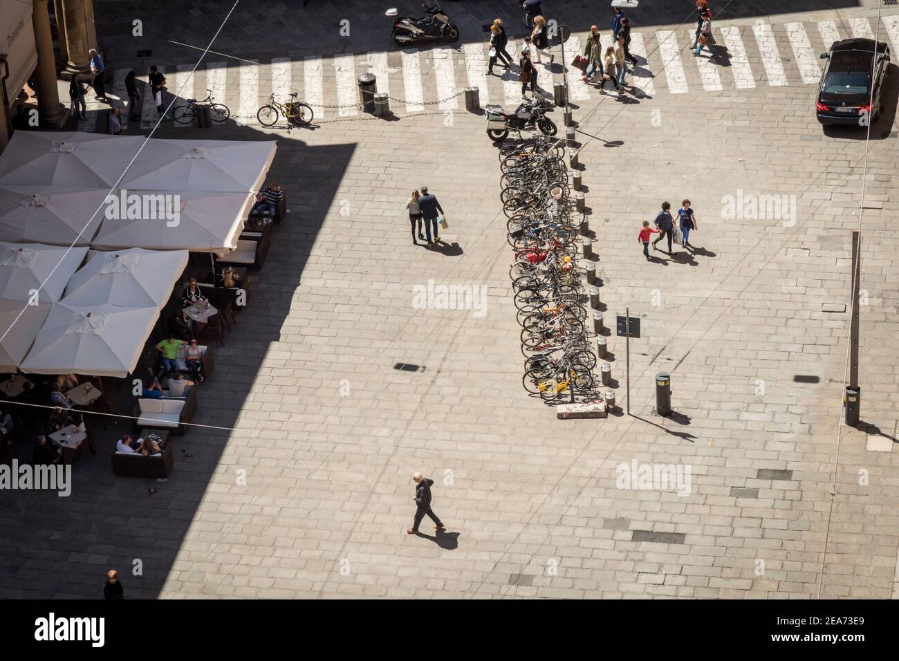 An aerial view of a square in the city of Bologna Italy showing people and a cycle rack Stock Photo
