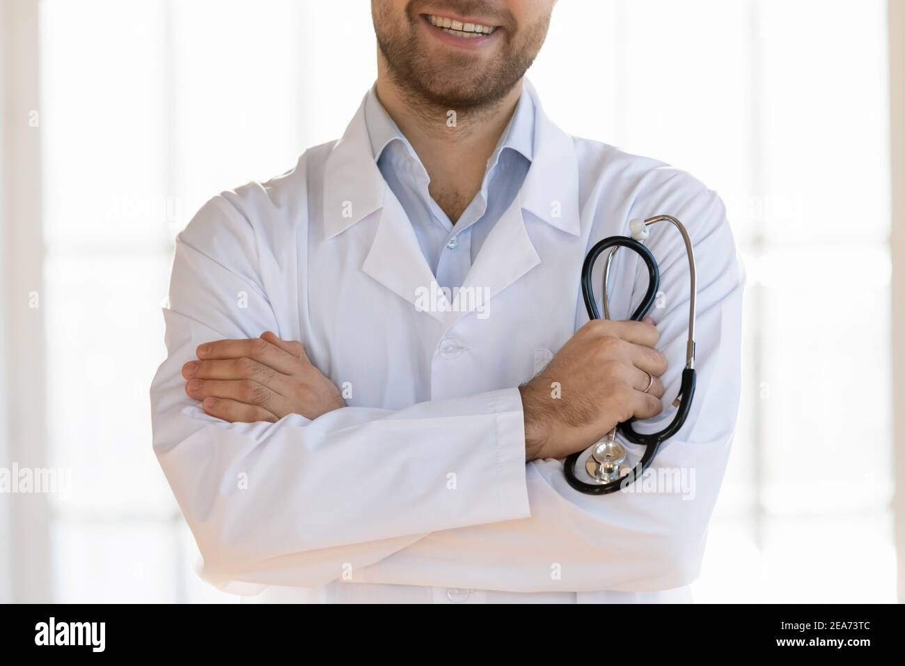 Cloe up of smiling male doctor in white medical uniform Stock Photo - Alamy