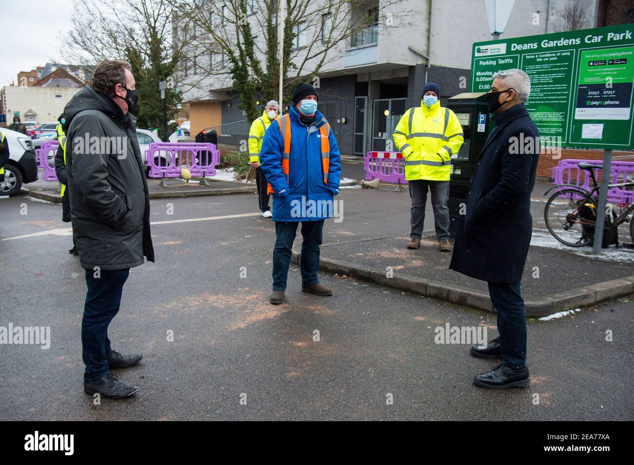 Mayor of London Sadiq Khan (right) and Leader of Ealing Council Julian Bell (left) speak to a member of staff carrying out mobile and door-to-door testing for the South African Covid-19 variant in Ealing, London. Picture date: Monday February 8, 2021. Stock Photo