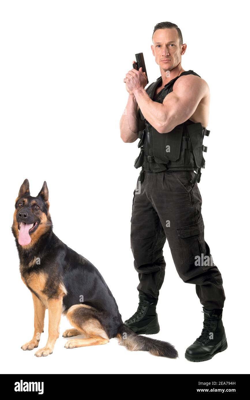 Police dog and agent with tactical vest and gun isolated in white Stock Photo