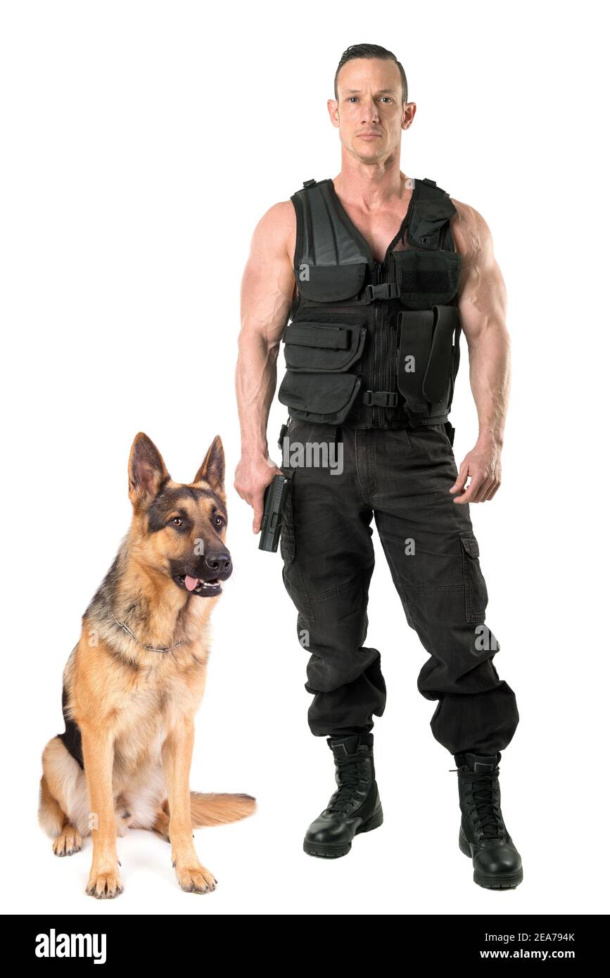 Police dog and agent with tactical vest and gun isolated in white Stock Photo