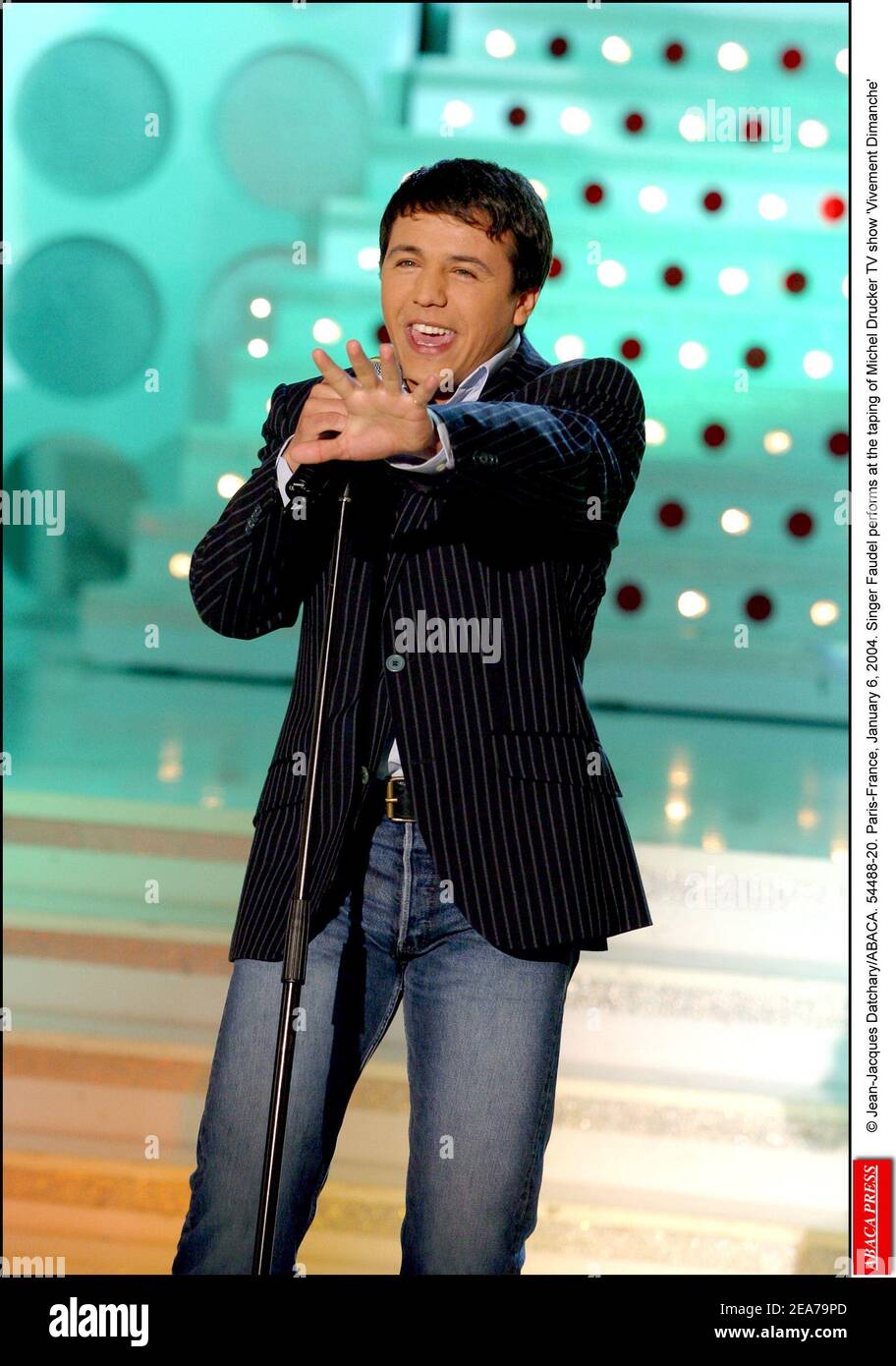 © Jean-Jacques Datchary/ABACA. 54488-20. Paris-France, January 6, 2004. Singer Faudel performs at the taping of Michel Drucker TV show 'Vivement Dimanche' Stock Photo