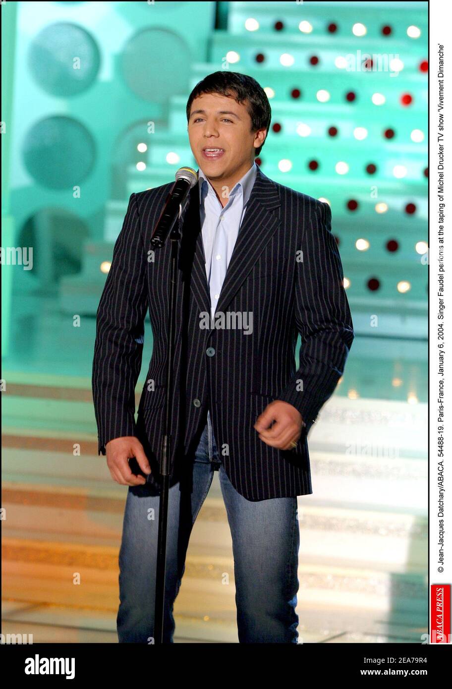 © Jean-Jacques Datchary/ABACA. 54488-19. Paris-France, January 6, 2004. Singer Faudel perfoms at the taping of Michel Drucker TV show 'Vivement Dimanche' Stock Photo