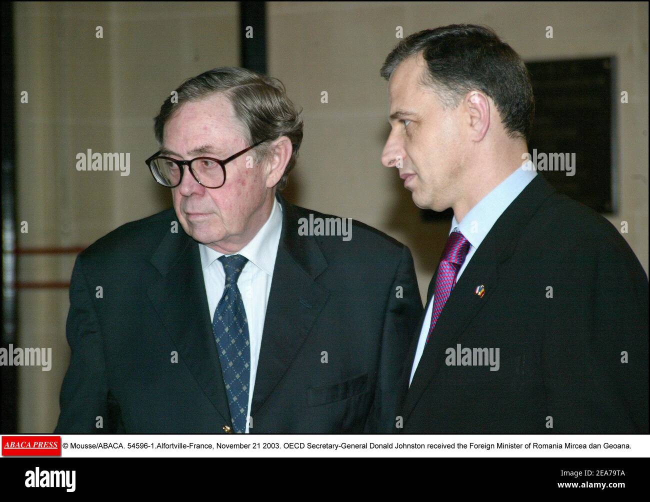 © Mousse/ABACA. 54596-1.Alfortville-France, November 21 2003. OECD Secretary-General Donald Johnston received the Foreign Minister of Romania Mircea dan Geoana. Stock Photo