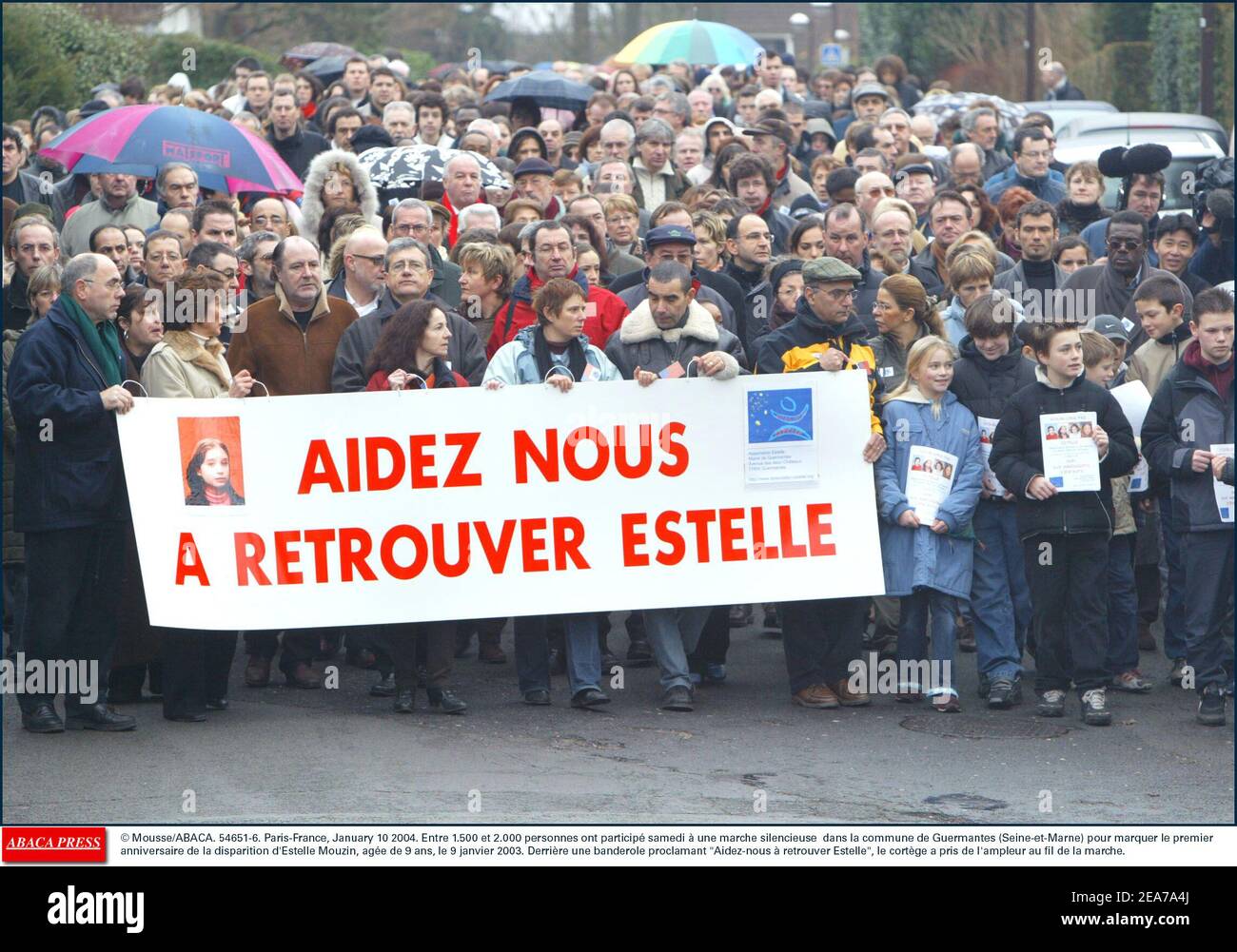 © Mousse/ABACA. 54651-6. Paris-France, January 10 2004. Entre 1.500 et 2.000 personnes ont particip samedi ˆ une marche silencieuse dans la commune de Guermantes (Seine-et-Marne) pour marquer le premier anniversaire de la disparition d'Estelle Mouzin, age de 9 ans, le 9 janvier 2003. Derrire une banderole proclamant Aidez-nous ˆ retrouver Estelle, le cortge a pris de l'ampleur au fil de la marche. Stock Photo