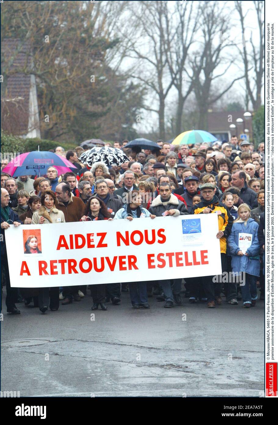 © Mousse/ABACA. 54651-7. Paris-France, January 10 2004. Entre 1.500 et 2.000 personnes ont particip samedi ˆ une marche silencieuse dans la commune de Guermantes (Seine-et-Marne) pour marquer le premier anniversaire de la disparition d'Estelle Mouzin, age de 9 ans, le 9 janvier 2003. Derrire une banderole proclamant Aidez-nous ˆ retrouver Estelle, le cortge a pris de l'ampleur au fil de la marche. Stock Photo