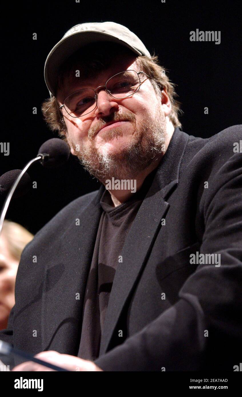 Director Michael Moore presents some of the ads of the Bush