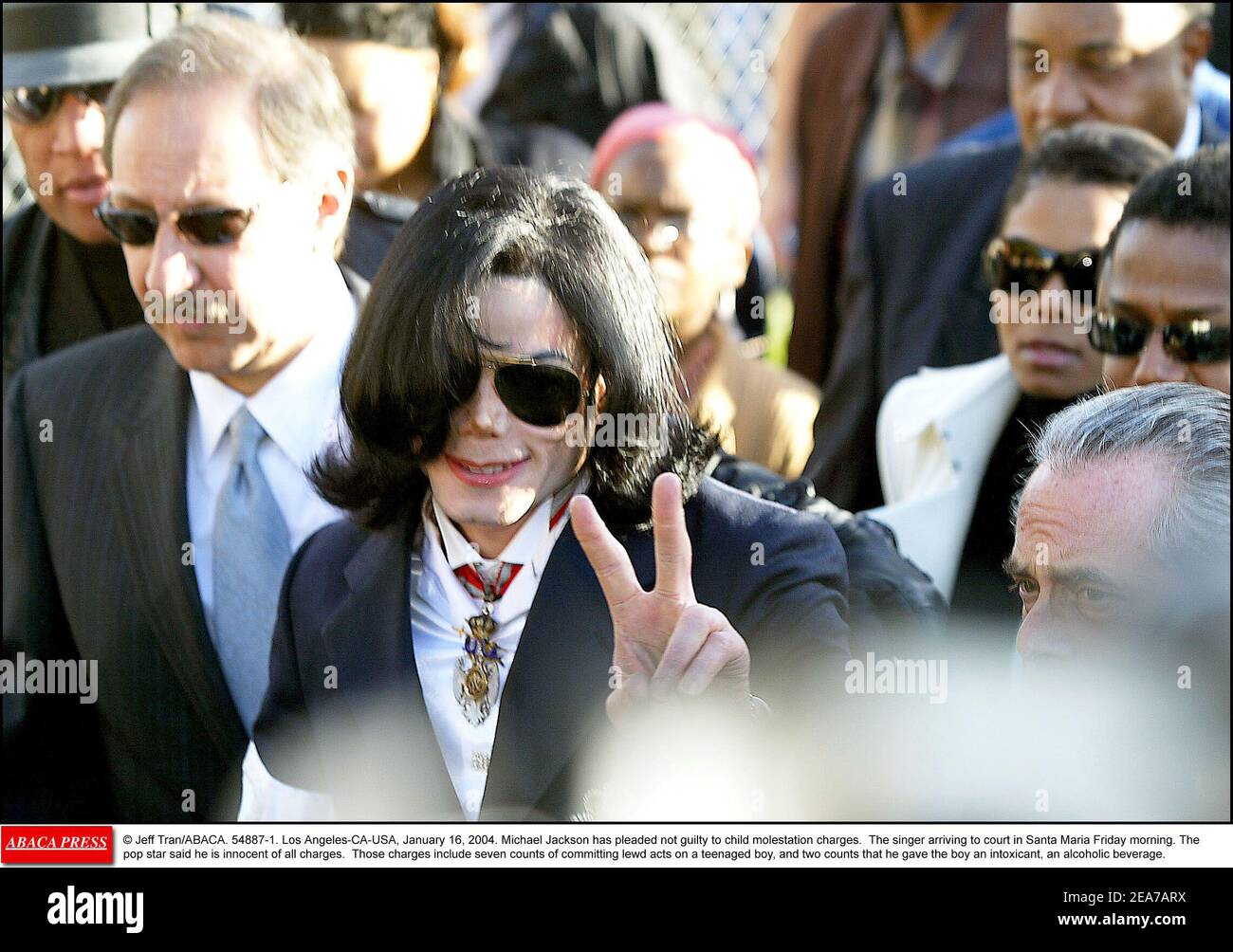 © Jeff Tran/ABACA. 54887-1. Los Angeles-CA-USA, January 16, 2004. Michael Jackson has pleaded not guilty to child molestation charges. The singer arriving to court in Santa Maria Friday morning. The pop star said he is innocent of all charges. Those charges include seven counts of committing lewd acts on a teenaged boy, and two counts that he gave the boy an intoxicant, an alcoholic beverage. Stock Photo