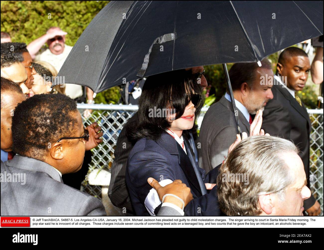 © Jeff Tran/ABACA. 54887-5. Los Angeles-CA-USA, January 16, 2004. Michael Jackson has pleaded not guilty to child molestation charges. The singer arriving to court in Santa Maria Friday morning. The pop star said he is innocent of all charges. Those charges include seven counts of committing lewd acts on a teenaged boy, and two counts that he gave the boy an intoxicant, an alcoholic beverage. Stock Photo