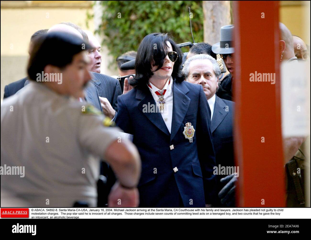 © ABACA. 54892-8. Santa Maria-CA-USA, January 16, 2004. Michael Jackson arriving at the Santa Maria, CA Courthouse with his family and lawyers. Jackson has pleaded not guilty to child molestation charges. The pop star said he is innocent of all charges. Those charges include seven counts of committing lewd acts on a teenaged boy, and two counts that he gave the boy an intoxicant, an alcoholic beverage. Stock Photo