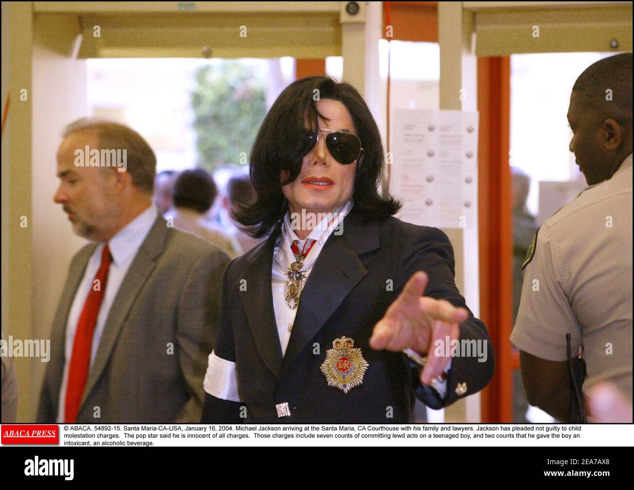 © ABACA. 54892-15. Santa Maria-CA-USA, January 16, 2004. Michael Jackson arriving at the Santa Maria, CA Courthouse with his family and lawyers. Jackson has pleaded not guilty to child molestation charges. The pop star said he is innocent of all charges. Those charges include seven counts of committing lewd acts on a teenaged boy, and two counts that he gave the boy an intoxicant, an alcoholic beverage. Stock Photo