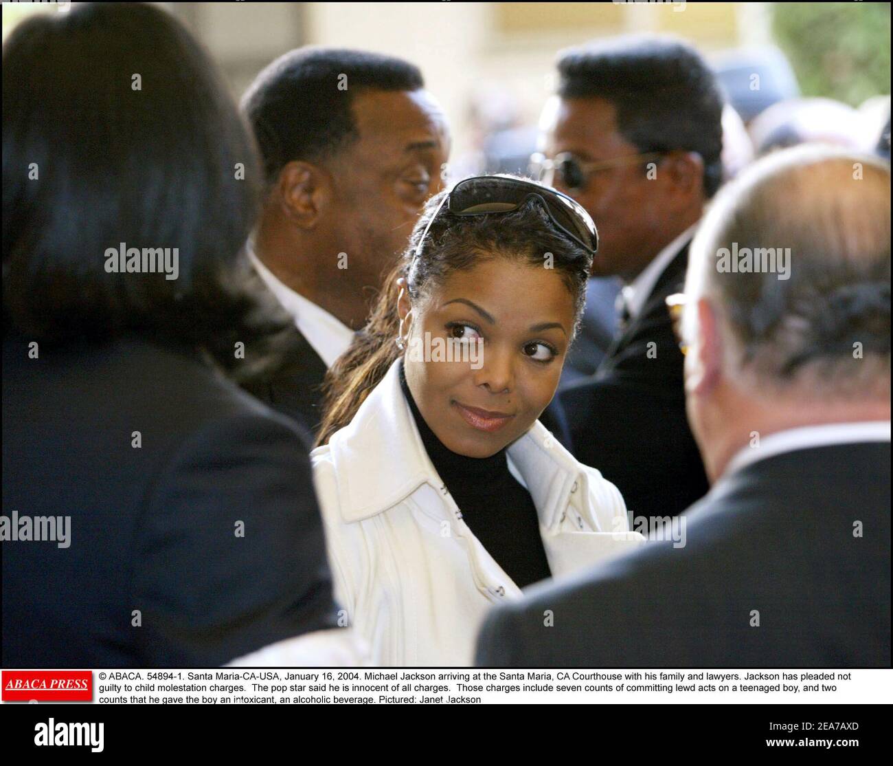 © ABACA. 54894-1. Santa Maria-CA-USA, January 16, 2004. Michael Jackson arriving at the Santa Maria, CA Courthouse with his family and lawyers. Jackson has pleaded not guilty to child molestation charges. The pop star said he is innocent of all charges. Those charges include seven counts of committing lewd acts on a teenaged boy, and two counts that he gave the boy an intoxicant, an alcoholic beverage. Pictured: Janet Jackson Stock Photo
