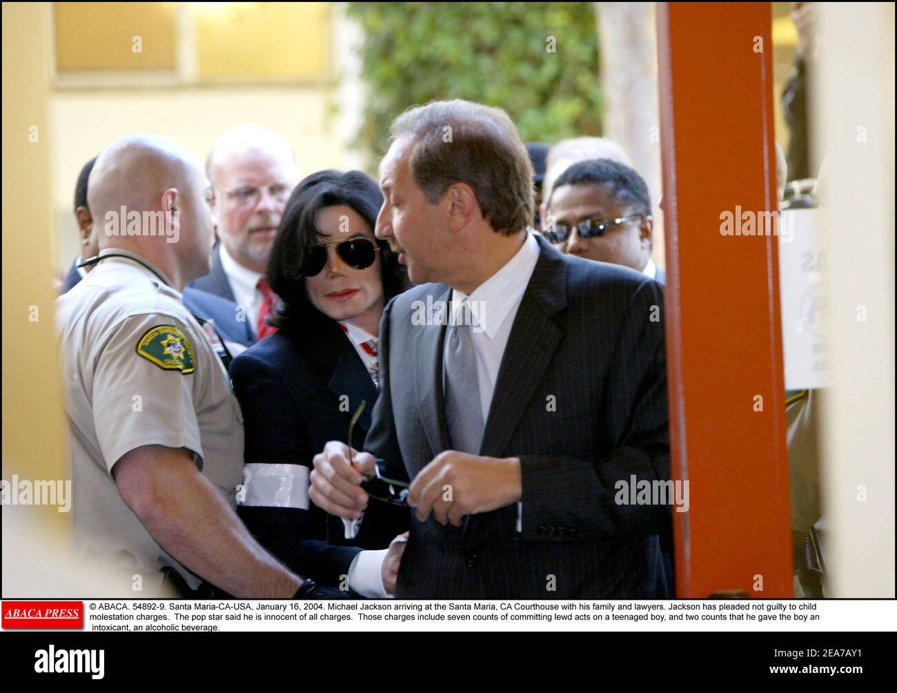 © ABACA. 54892-9. Santa Maria-CA-USA, January 16, 2004. Michael Jackson arriving at the Santa Maria, CA Courthouse with his family and lawyers. Jackson has pleaded not guilty to child molestation charges. The pop star said he is innocent of all charges. Those charges include seven counts of committing lewd acts on a teenaged boy, and two counts that he gave the boy an intoxicant, an alcoholic beverage. Stock Photo