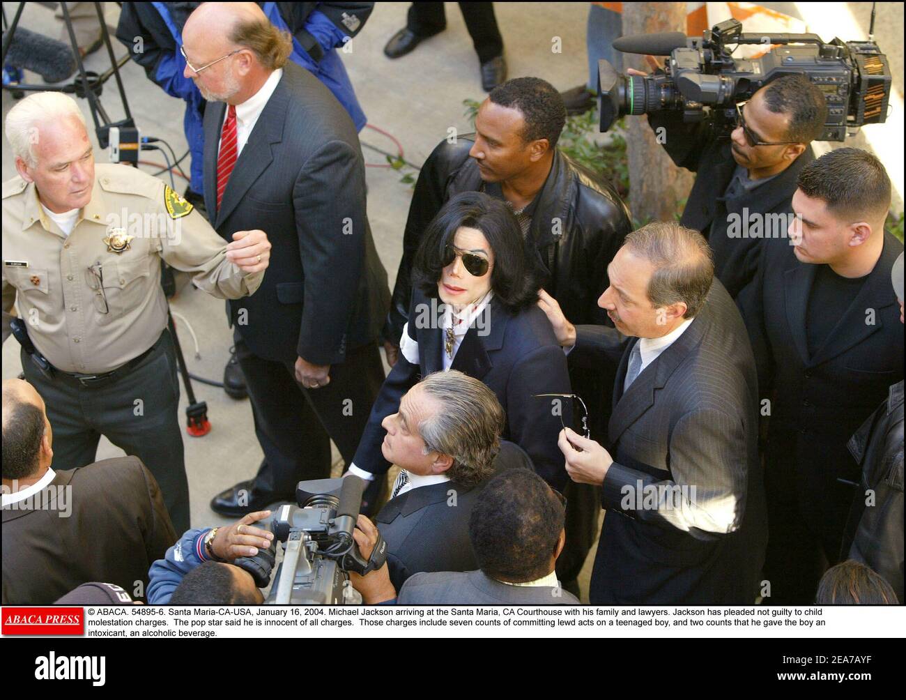 © ABACA. 54895-6. Santa Maria-CA-USA, January 16, 2004. Michael Jackson arriving at the Santa Maria, CA Courthouse with his family and lawyers. Jackson has pleaded not guilty to child molestation charges. The pop star said he is innocent of all charges. Those charges include seven counts of committing lewd acts on a teenaged boy, and two counts that he gave the boy an intoxicant, an alcoholic beverage. Stock Photo