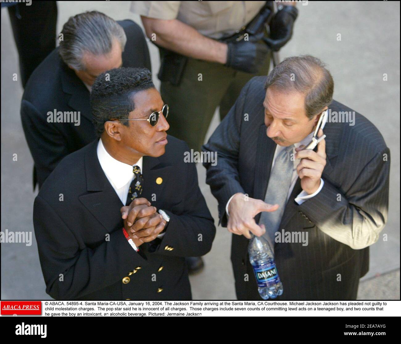 © ABACA. 54895-4. Santa Maria-CA-USA, January 16, 2004. The Jackson Family arriving at the Santa Maria, CA Courthouse. Michael Jackson Jackson has pleaded not guilty to child molestation charges. The pop star said he is innocent of all charges. Those charges include seven counts of committing lewd acts on a teenaged boy, and two counts that he gave the boy an intoxicant, an alcoholic beverage. Pictured: Jermaine Jackson Stock Photo