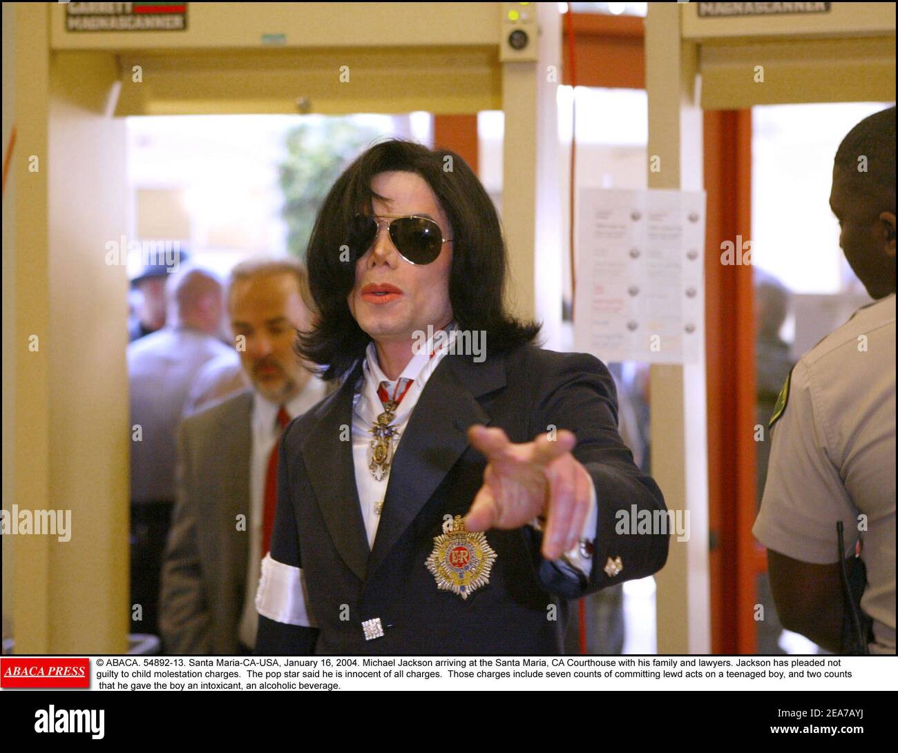 © ABACA. 54892-13. Santa Maria-CA-USA, January 16, 2004. Michael Jackson arriving at the Santa Maria, CA Courthouse with his family and lawyers. Jackson has pleaded not guilty to child molestation charges. The pop star said he is innocent of all charges. Those charges include seven counts of committing lewd acts on a teenaged boy, and two counts that he gave the boy an intoxicant, an alcoholic beverage. Stock Photo