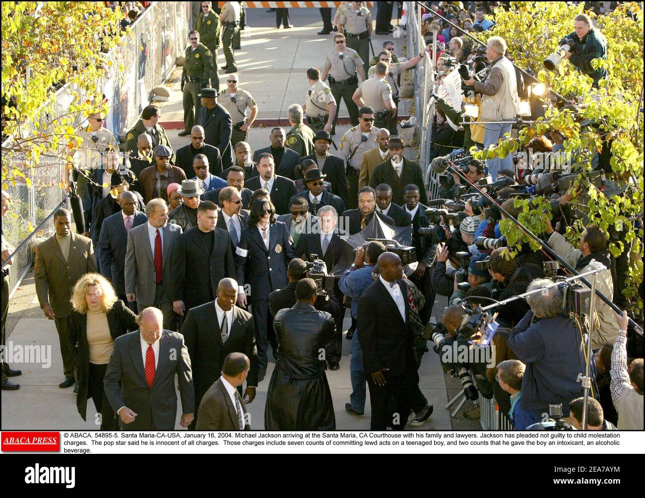 © ABACA. 54895-5. Santa Maria-CA-USA, January 16, 2004. Michael Jackson arriving at the Santa Maria, CA Courthouse with his family and lawyers. Jackson has pleaded not guilty to child molestation charges. The pop star said he is innocent of all charges. Those charges include seven counts of committing lewd acts on a teenaged boy, and two counts that he gave the boy an intoxicant, an alcoholic beverage. Stock Photo