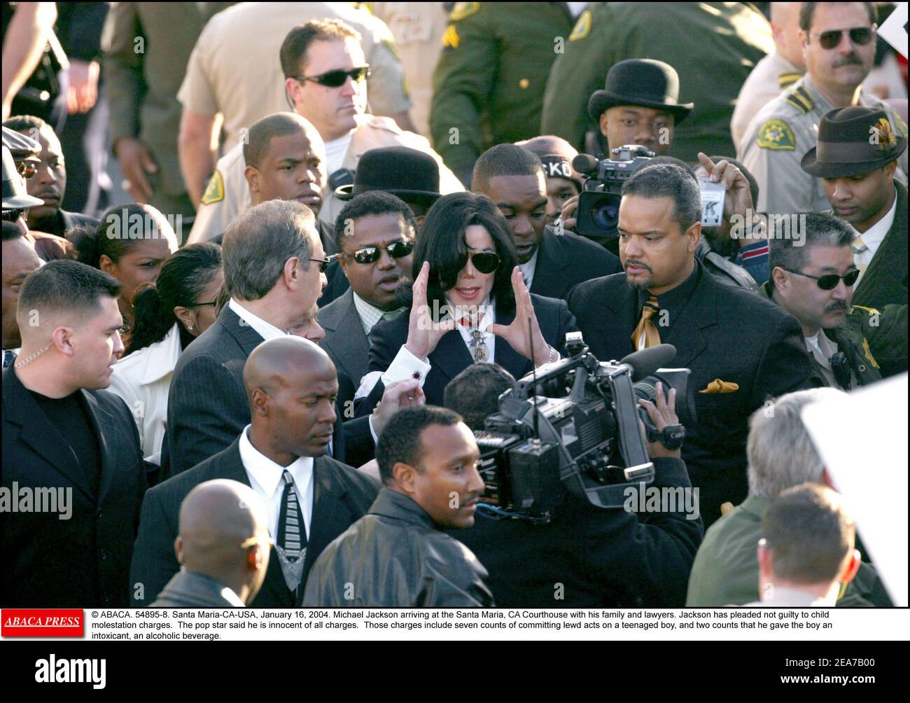 © ABACA. 54895-8. Santa Maria-CA-USA, January 16, 2004. Michael Jackson arriving at the Santa Maria, CA Courthouse with his family and lawyers. Jackson has pleaded not guilty to child molestation charges. The pop star said he is innocent of all charges. Those charges include seven counts of committing lewd acts on a teenaged boy, and two counts that he gave the boy an intoxicant, an alcoholic beverage. Stock Photo