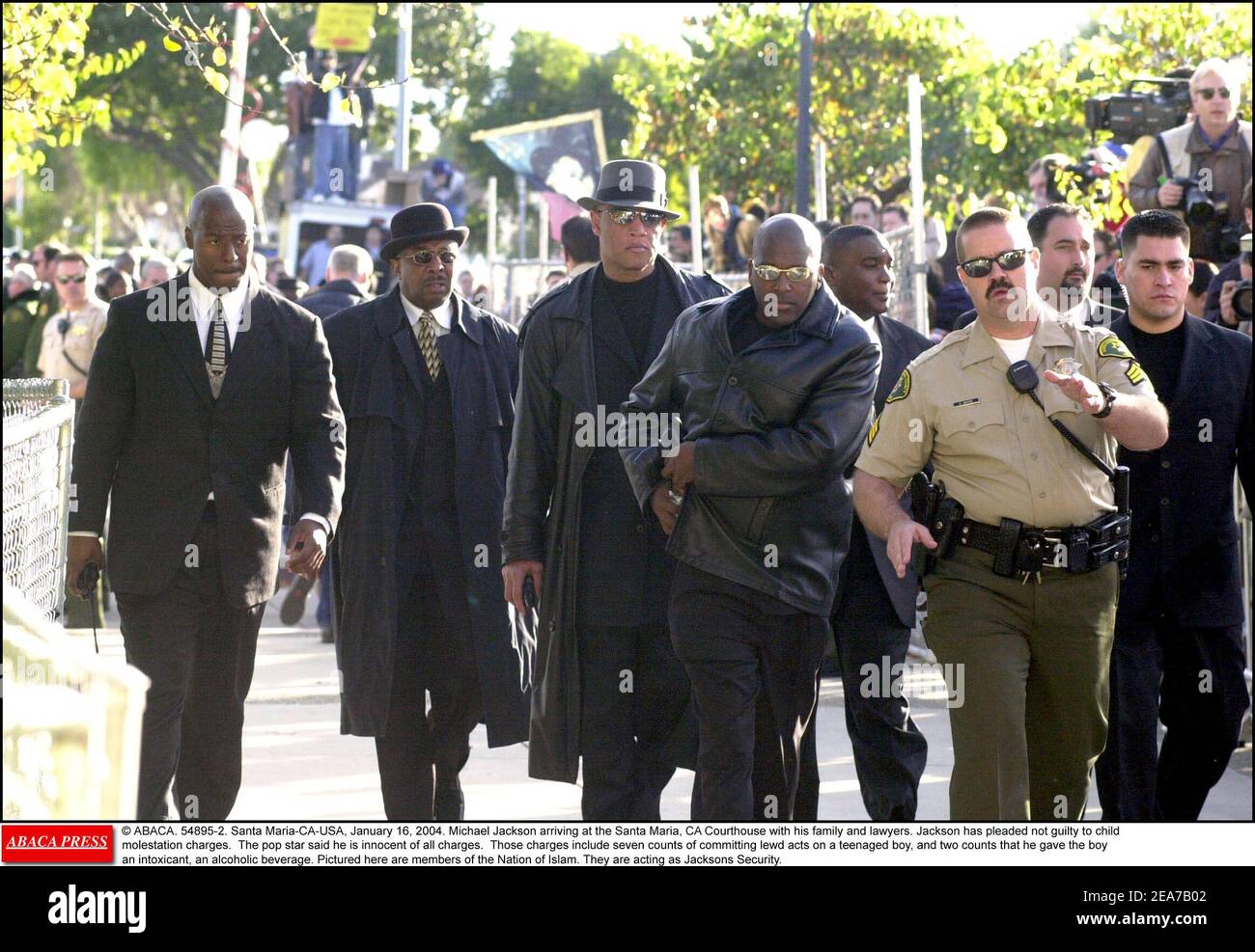 © ABACA. 54895-2. Santa Maria-CA-USA, January 16, 2004. Michael Jackson arriving at the Santa Maria, CA Courthouse with his family and lawyers. Jackson has pleaded not guilty to child molestation charges. The pop star said he is innocent of all charges. Those charges include seven counts of committing lewd acts on a teenaged boy, and two counts that he gave the boy an intoxicant, an alcoholic beverage. Pictured here are members of the Nation of Islam. They are acting as Jacksons Security. Stock Photo
