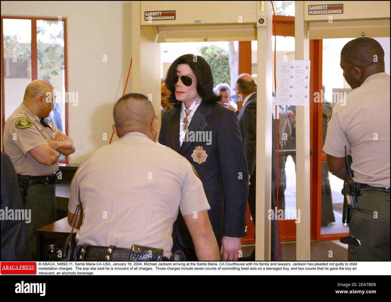 © ABACA. 54892-11. Santa Maria-CA-USA, January 16, 2004. Michael Jackson arriving at the Santa Maria, CA Courthouse with his family and lawyers. Jackson has pleaded not guilty to child molestation charges. The pop star said he is innocent of all charges. Those charges include seven counts of committing lewd acts on a teenaged boy, and two counts that he gave the boy an intoxicant, an alcoholic beverage. Stock Photo