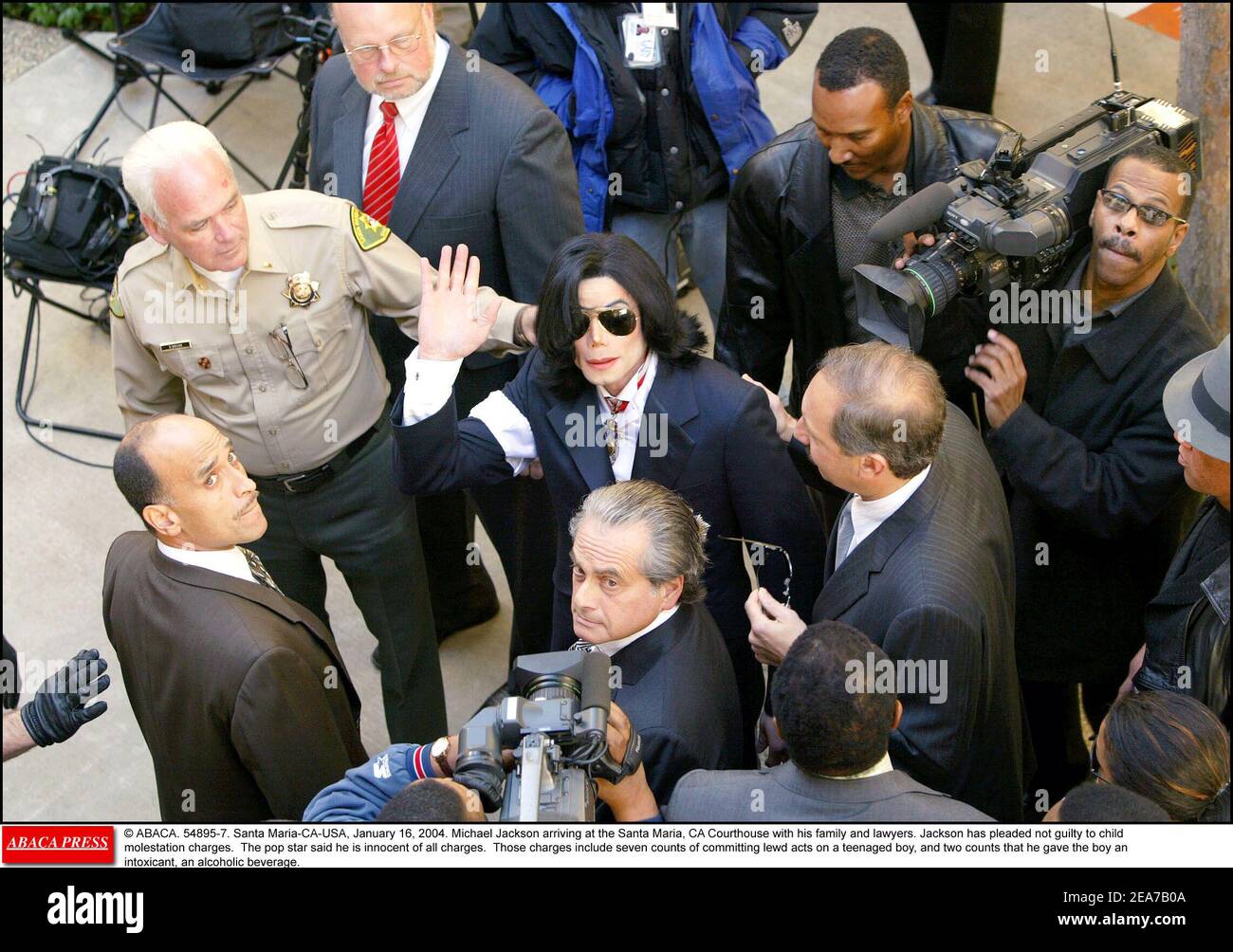 © ABACA. 54895-7. Santa Maria-CA-USA, January 16, 2004. Michael Jackson arriving at the Santa Maria, CA Courthouse with his family and lawyers. Jackson has pleaded not guilty to child molestation charges. The pop star said he is innocent of all charges. Those charges include seven counts of committing lewd acts on a teenaged boy, and two counts that he gave the boy an intoxicant, an alcoholic beverage. Stock Photo