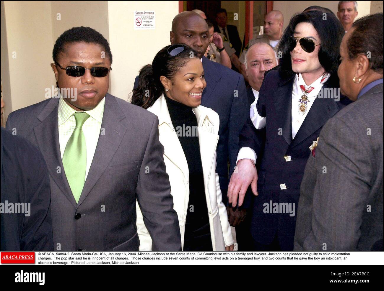 © ABACA. 54894-2. Santa Maria-CA-USA, January 16, 2004. Michael Jackson at the Santa Maria, CA Courthouse with his family and lawyers. Jackson has pleaded not guilty to child molestation charges. The pop star said he is innocent of all charges. Those charges include seven counts of committing lewd acts on a teenaged boy, and two counts that he gave the boy an intoxicant, an alcoholic beverage. Pictured: Janet Jackson, Michael Jackson Stock Photo