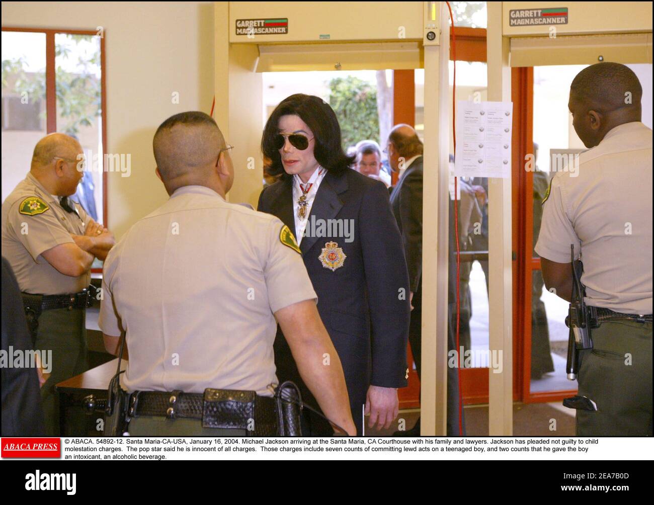 © ABACA. 54892-12. Santa Maria-CA-USA, January 16, 2004. Michael Jackson arriving at the Santa Maria, CA Courthouse with his family and lawyers. Jackson has pleaded not guilty to child molestation charges. The pop star said he is innocent of all charges. Those charges include seven counts of committing lewd acts on a teenaged boy, and two counts that he gave the boy an intoxicant, an alcoholic beverage. Stock Photo
