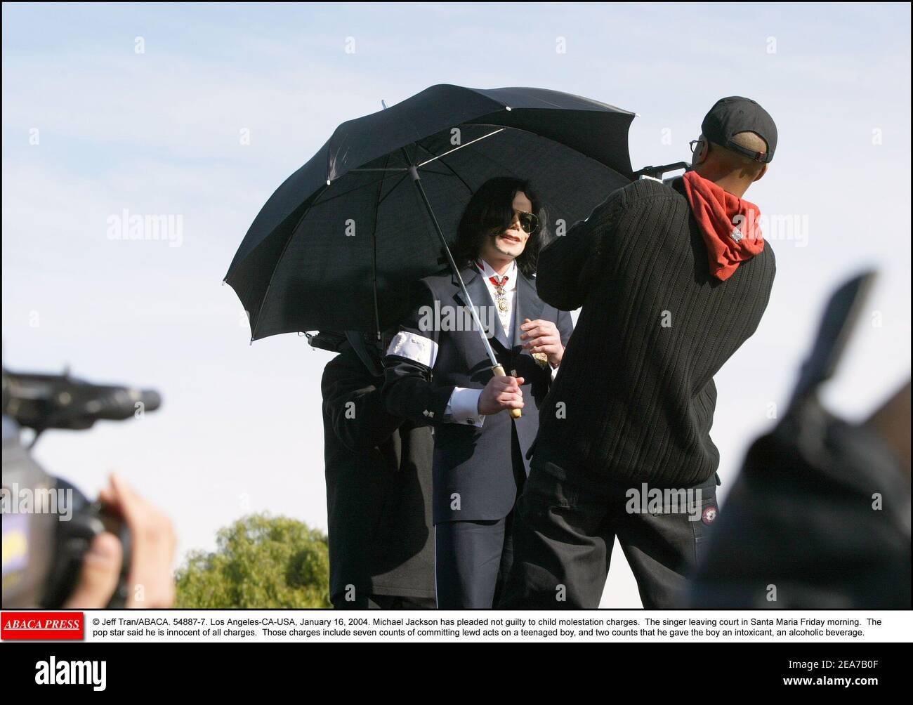 © Jeff Tran/ABACA. 54887-7. Los Angeles-CA-USA, January 16, 2004. Michael Jackson has pleaded not guilty to child molestation charges. The singer leaving court in Santa Maria Friday morning. The pop star said he is innocent of all charges. Those charges include seven counts of committing lewd acts on a teenaged boy, and two counts that he gave the boy an intoxicant, an alcoholic beverage. Stock Photo