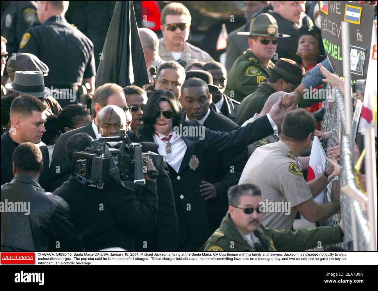 © ABACA. 54895-10. Santa Maria-CA-USA, January 16, 2004. Michael Jackson arriving at the Santa Maria, CA Courthouse with his family and lawyers. Jackson has pleaded not guilty to child molestation charges. The pop star said he is innocent of all charges. Those charges include seven counts of committing lewd acts on a teenaged boy, and two counts that he gave the boy an intoxicant, an alcoholic beverage. Stock Photo