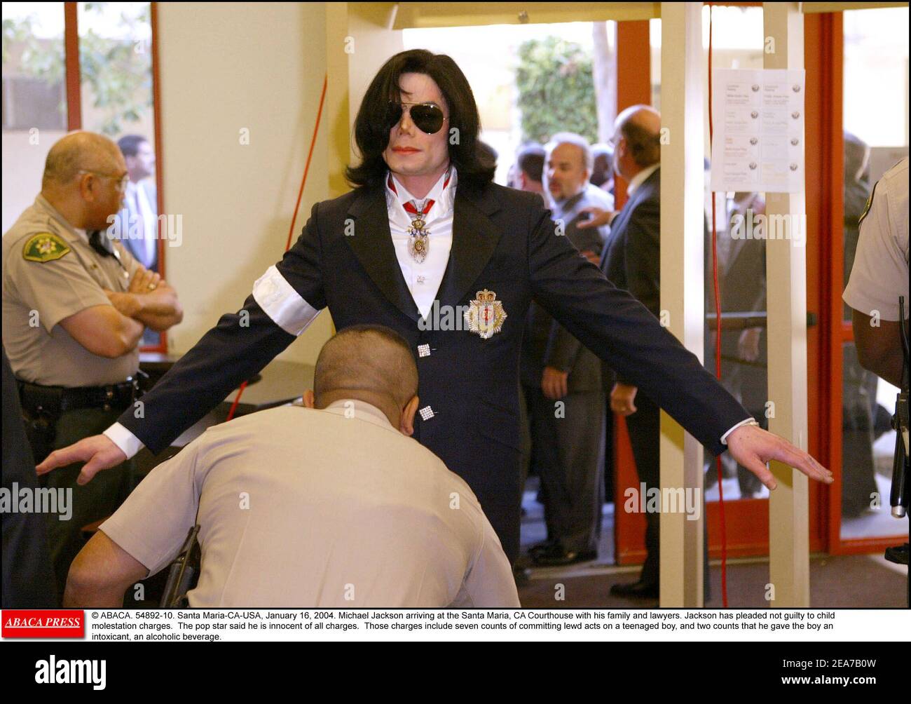 © ABACA. 54892-10. Santa Maria-CA-USA, January 16, 2004. Michael Jackson arriving at the Santa Maria, CA Courthouse with his family and lawyers. Jackson has pleaded not guilty to child molestation charges. The pop star said he is innocent of all charges. Those charges include seven counts of committing lewd acts on a teenaged boy, and two counts that he gave the boy an intoxicant, an alcoholic beverage. Stock Photo