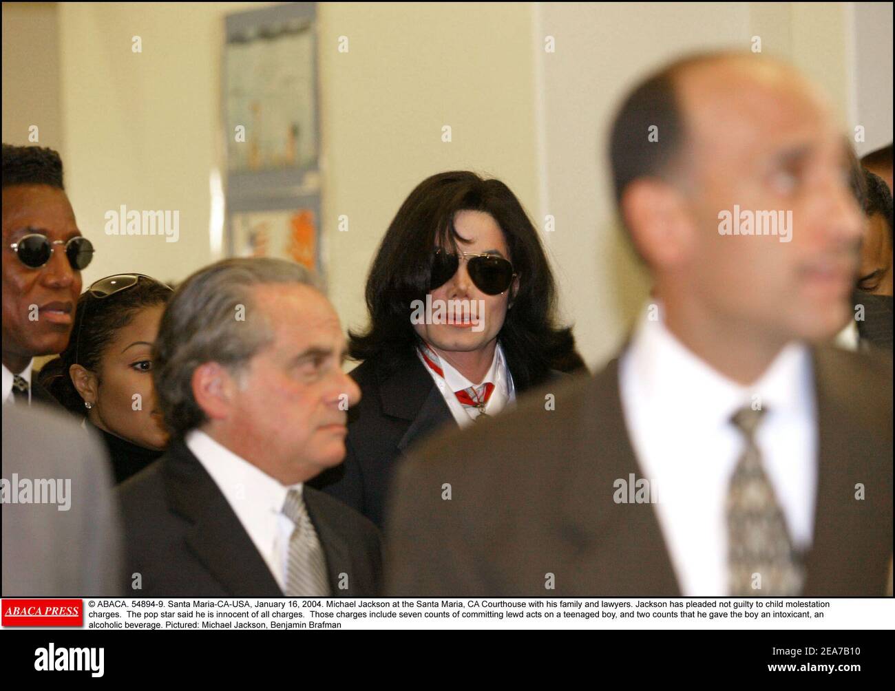 © ABACA. 54894-9. Santa Maria-CA-USA, January 16, 2004. Michael Jackson at the Santa Maria, CA Courthouse with his family and lawyers. Jackson has pleaded not guilty to child molestation charges. The pop star said he is innocent of all charges. Those charges include seven counts of committing lewd acts on a teenaged boy, and two counts that he gave the boy an intoxicant, an alcoholic beverage. Pictured: Michael Jackson, Benjamin Brafman Stock Photo