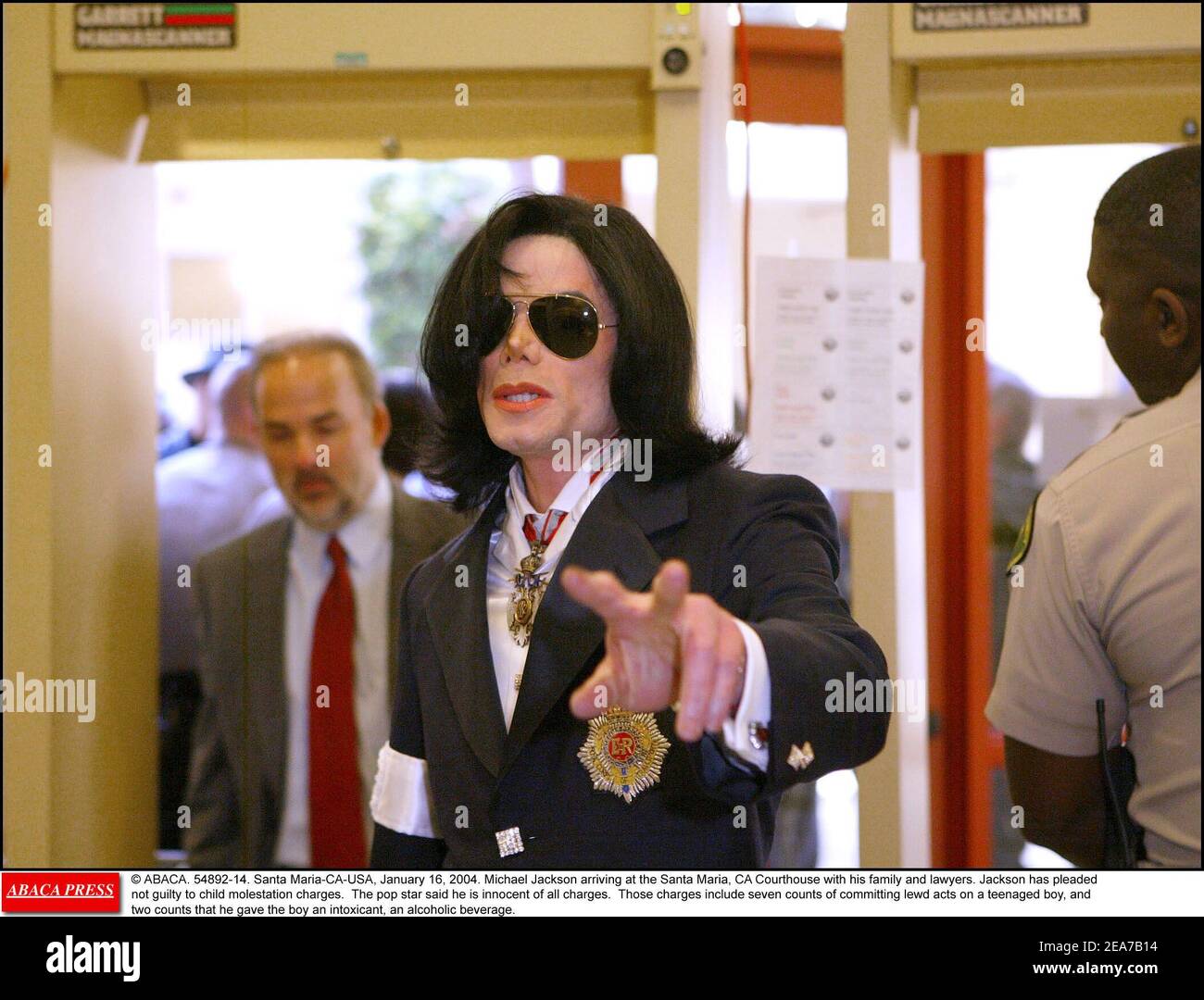 © ABACA. 54892-14. Santa Maria-CA-USA, January 16, 2004. Michael Jackson arriving at the Santa Maria, CA Courthouse with his family and lawyers. Jackson has pleaded not guilty to child molestation charges. The pop star said he is innocent of all charges. Those charges include seven counts of committing lewd acts on a teenaged boy, and two counts that he gave the boy an intoxicant, an alcoholic beverage. Stock Photo