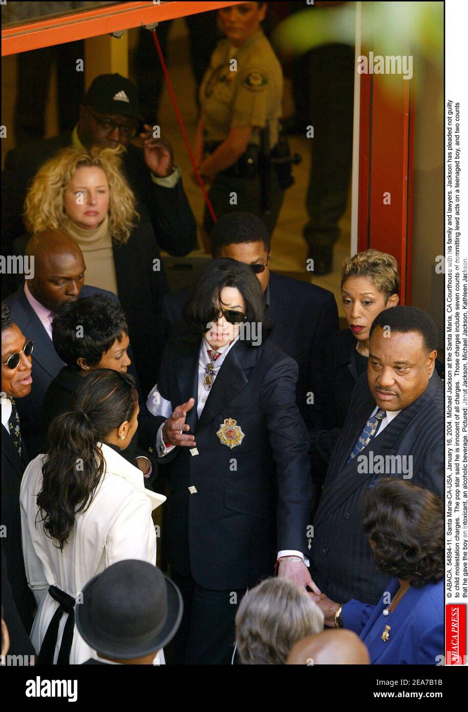 © ABACA. 54894-11. Santa Maria-CA-USA, January 16, 2004. Michael Jackson at the Santa Maria, CA Courthouse with his family and lawyers. Jackson has pleaded not guilty to child molestation charges. The pop star said he is innocent of all charges. Those charges include seven counts of committing lewd acts on a teenaged boy, and two counts that he gave the boy an intoxicant, an alcoholic beverage. Pictured: Janet Jackson, Michael Jackson, Kathleen Jackson. Stock Photo