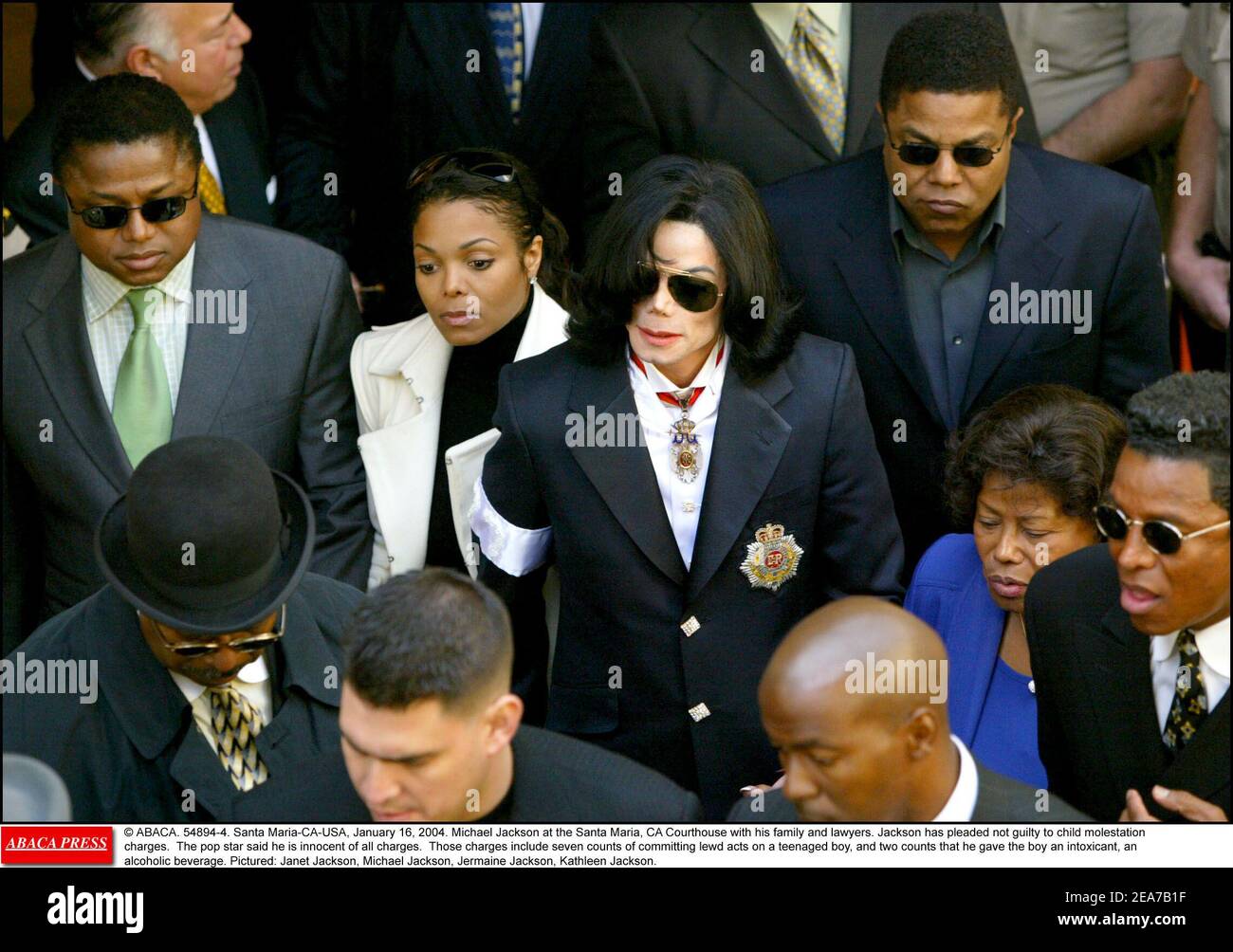 © ABACA. 54894-4. Santa Maria-CA-USA, January 16, 2004. Michael Jackson at the Santa Maria, CA Courthouse with his family and lawyers. Jackson has pleaded not guilty to child molestation charges. The pop star said he is innocent of all charges. Those charges include seven counts of committing lewd acts on a teenaged boy, and two counts that he gave the boy an intoxicant, an alcoholic beverage. Pictured: Janet Jackson, Michael Jackson, Jermaine Jackson, Kathleen Jackson. Stock Photo
