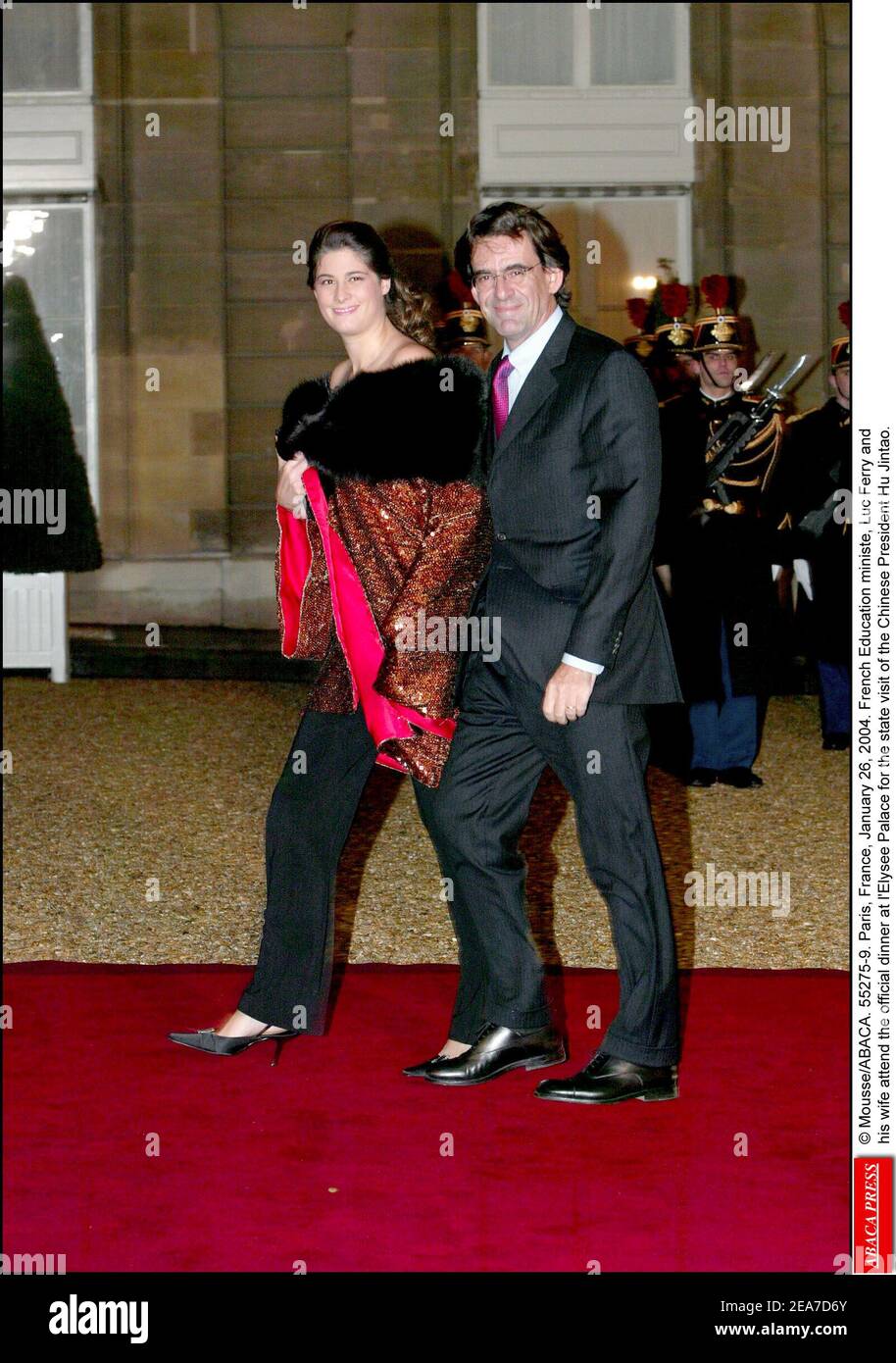 © Mousse/ABACA. 55275-9. Paris, France, January 26, 2004. French Education ministe, Luc Ferry and his wife attend the official dinner at l'Elysee Palace for the state visit of the Chinese President Hu Jintao. Stock Photo