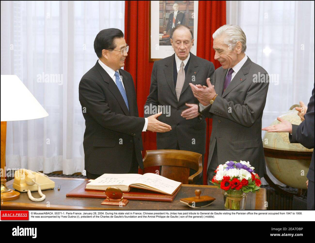 © Mousse/ABACA. 55371-1. Paris-France. January 28, 2004. During his state visit in France, Chinese president Hu Jintao has paid tribute to General de Gaulle visiting the Parisian office the general occupied from 1947 to 1958. He was accompanied by Yves Guna (r), prsident of the Charles de Gaulle's foundation and the Amiral Philippe de Gaulle ( son of the general) ( middle). Stock Photo