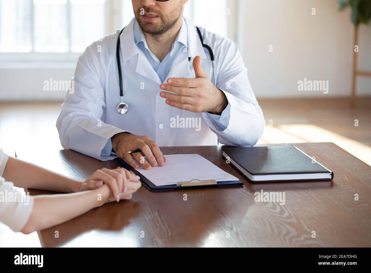 Close up of male doctor consult patient Stock Photo