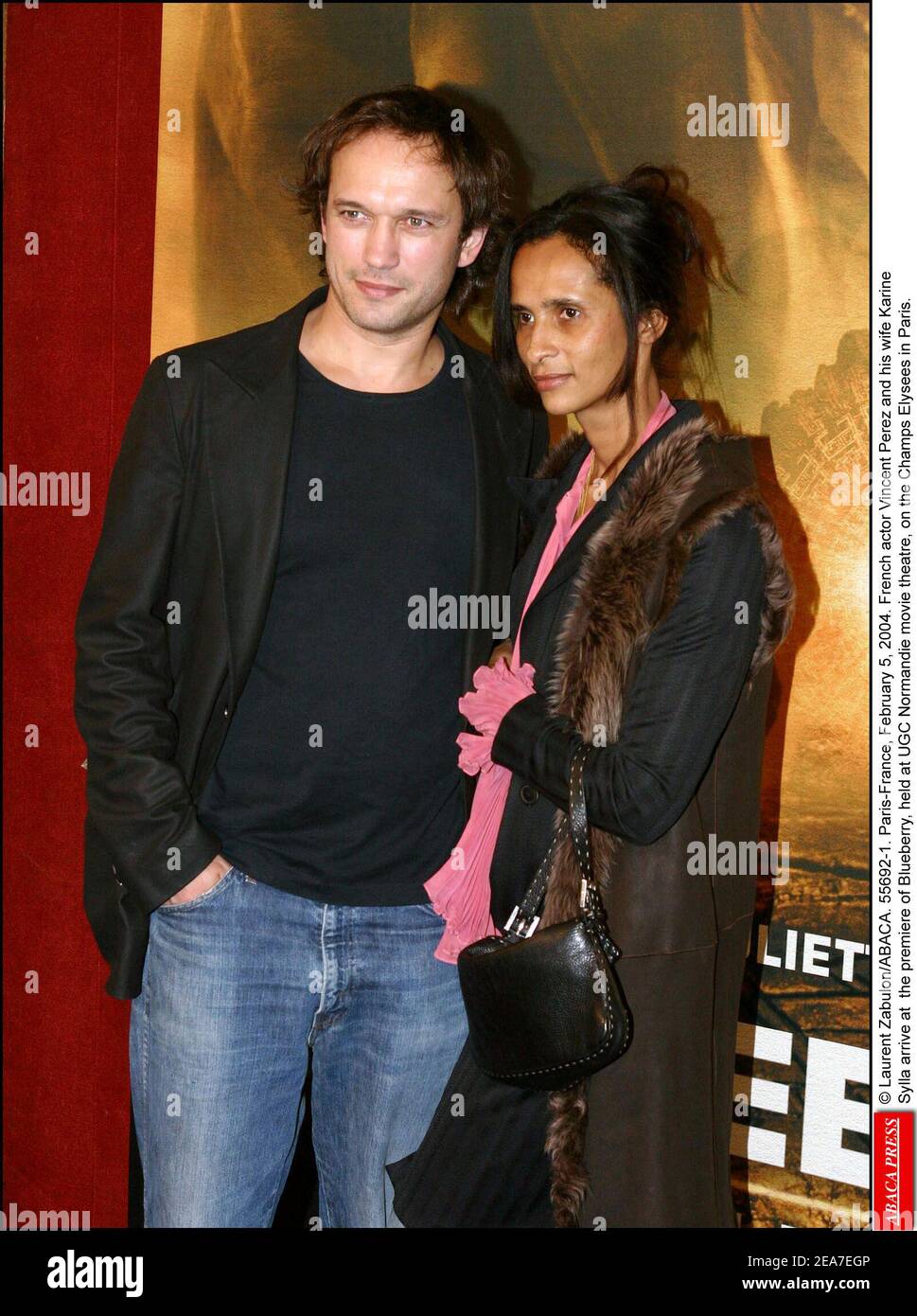 © Laurent Zabulon/ABACA. 55692-1. Paris-France, February 5, 2004. Swiss actor Vincent Perez and his wife Karine Sylla arrive at the premiere of Blueberry, held at UGC Normandie movie theatre, on the Champs Elysees in Paris. Stock Photo