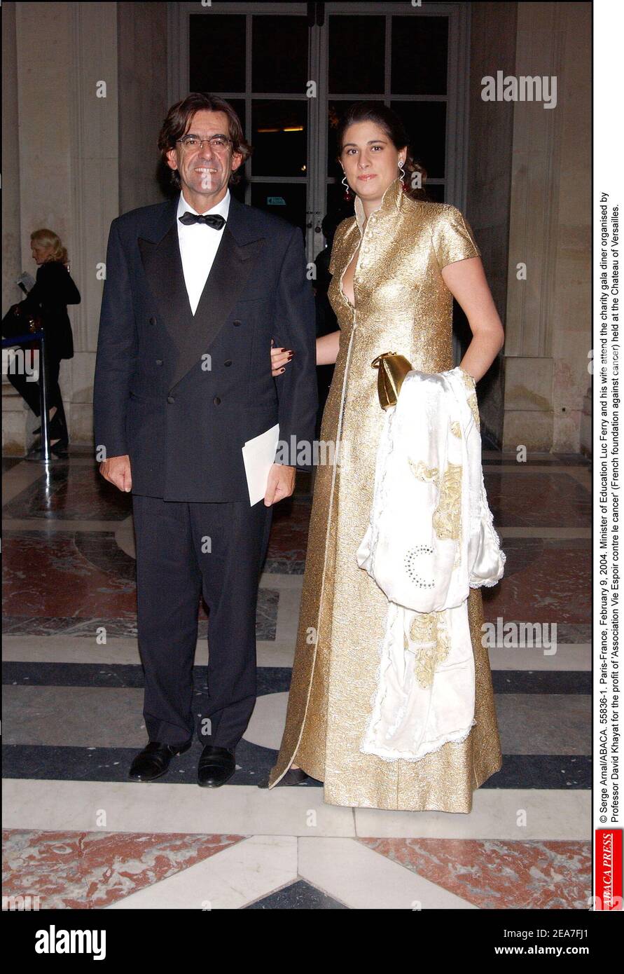 © Serge Arnal/ABACA. 55836-1. Versailles-France, February 9, 2004. Minister of Education Luc Ferry and his wife Marie-Caroline attend the charity gala diner organised by Professor David Khayat for the profit of 'Association Vie Espoir contre le cancer' (French foundation against cancer) held at the Castle of Versailles. Stock Photo