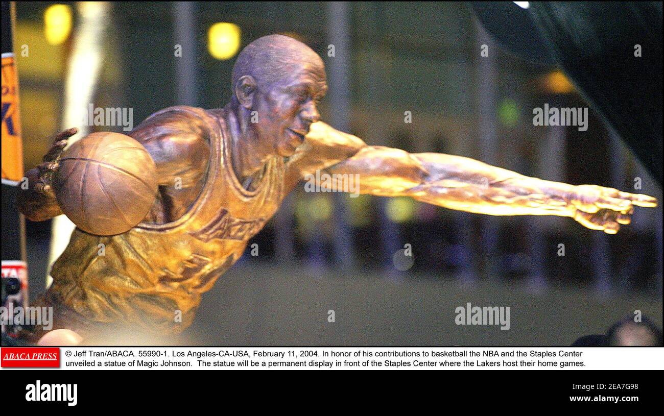 © Jeff Tran/ABACA. 55990-1. Los Angeles-CA-USA, February 11, 2004. In honor of his contributions to basketball the NBA and the Staples Center unveiled a statue of Magic Johnson. The statue will be a permanent display in front of the Staples Center where the Lakers host their home games. Stock Photo